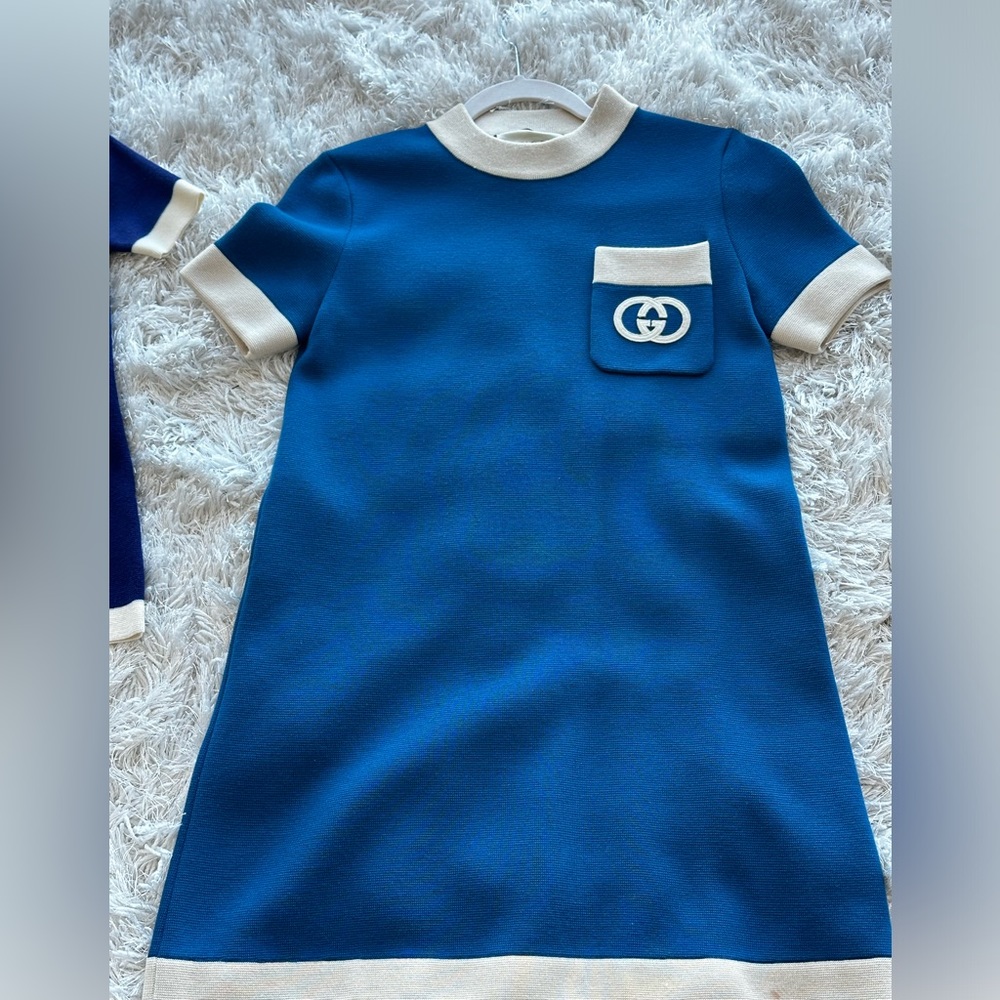Gucci dress size Xs worn once . Small stain at bottom. Mini dress color blue.